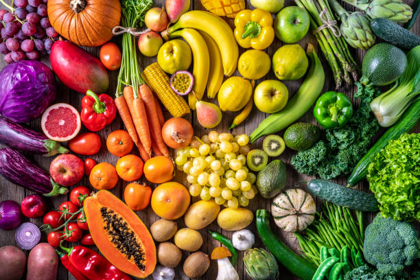 Colorful vegetables and fruits vegan food in rainbow colors arrangement full frame