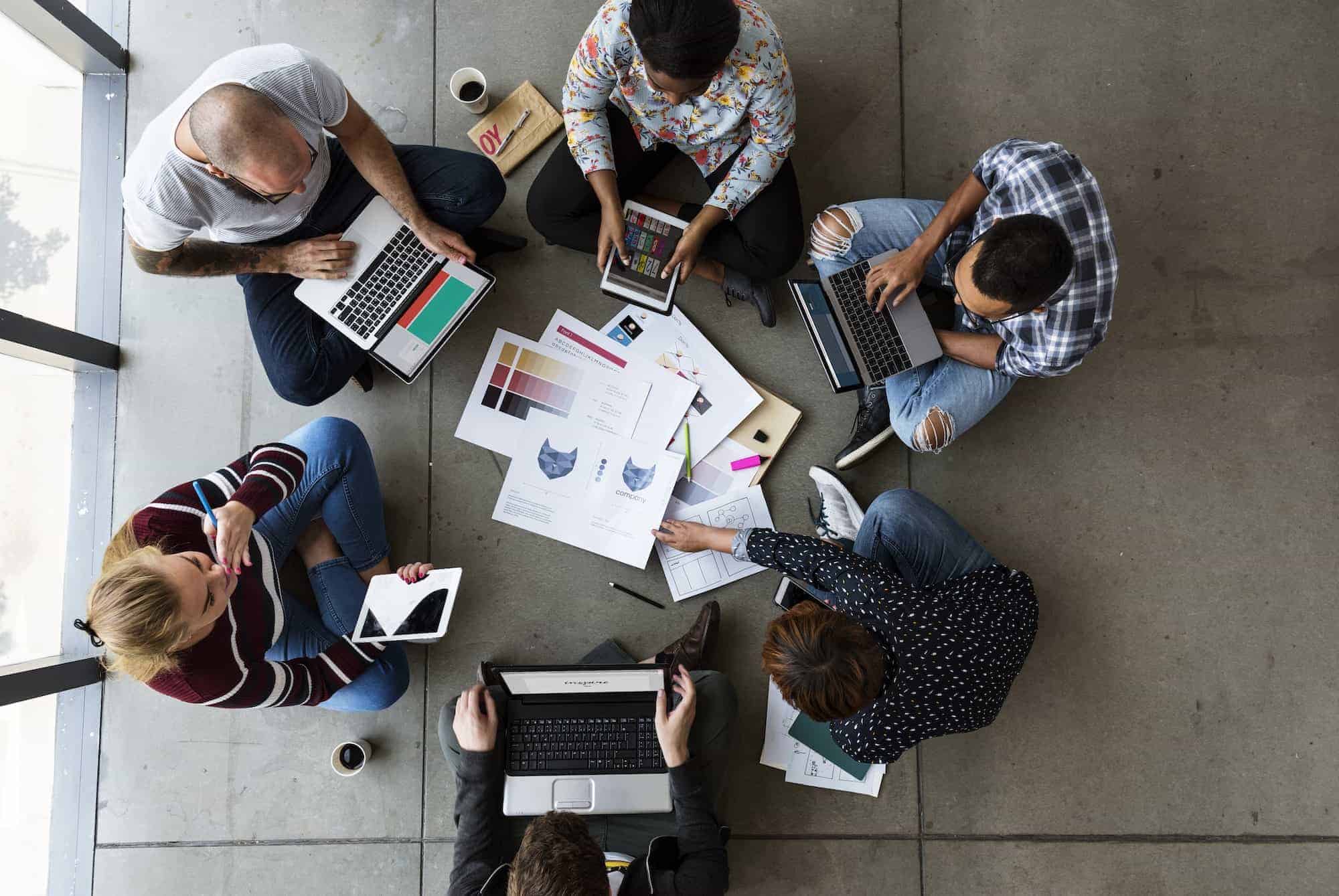 group-of-people-brainstorming-sitting-on-the-floor